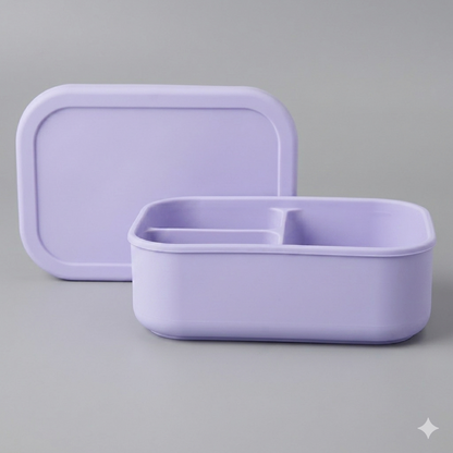 Aesthetic pastel lilac purple bento lunch box NZ, medium 3-compartment leakproof silicone lunchbox for daycare and school, bird's-eye view flat lay on bright neutral gray background.