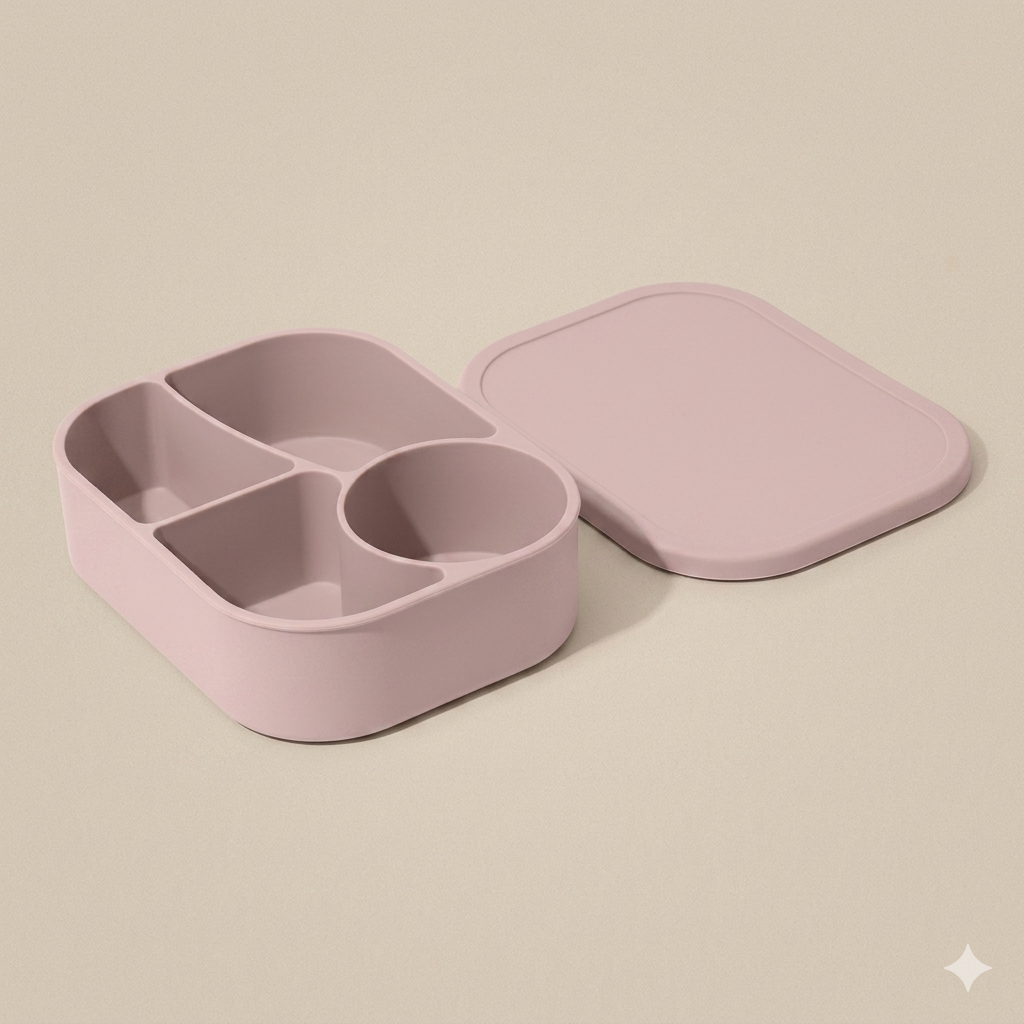 Blush Petal light pink BPA-free silicone bento box displaying a deep round compartment for snacks and leakproof edge sealing