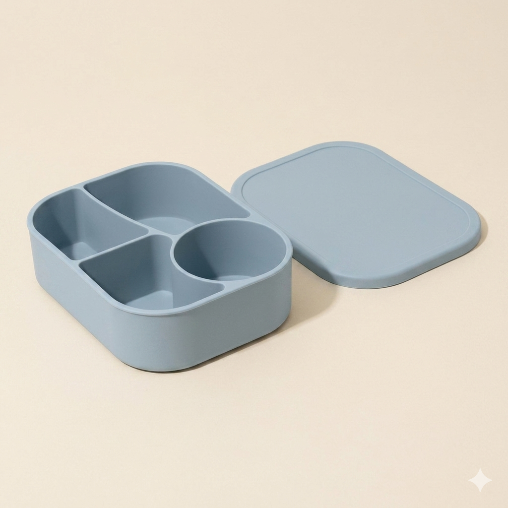 Pacific Mist blue durable silicone bento box for kids with a separate flexible 4-compartment base and matching lid.